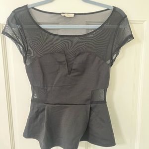 Black peplum top with cut outs and mesh